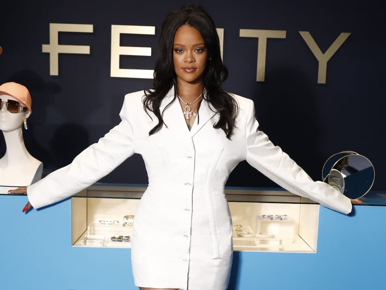 Rihanna in front of a FENTY Sign