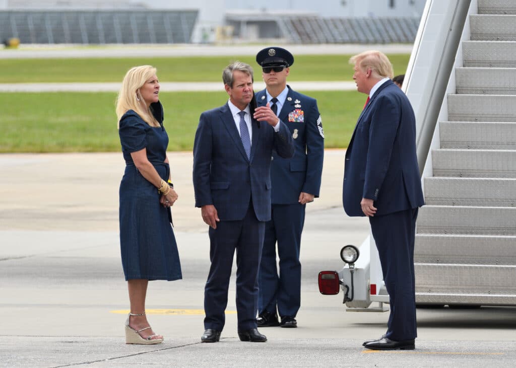 President Donald Trump greets Georgia Governor Brian Kemp and Georgia First Lady Marty Kemp